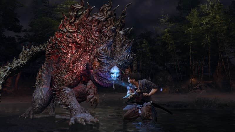 The protagonist braces against a hulking Genma beast in shallow water at the forest edge